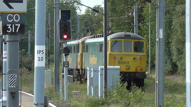 86 609 is stabled in a siding near Ipswich Station coupled with another Freightliner Class 86 Electric Locomotive.