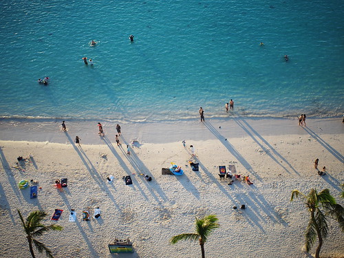 tumon bay sunset blue ocean sea guam shadow people vacation