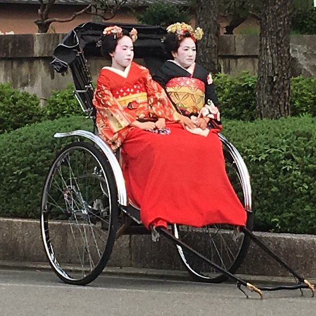 Geishas in Rickshaw, Gion Kyoto Japan
