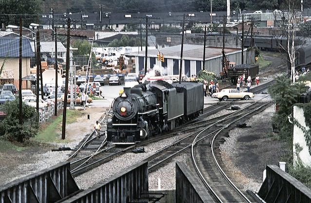 Southern Railway Baldwin 2-8-2 Mikado steam locomotive # 4501 with its tenders filled is now heading to the turntable in the yard to be turned prior to departing with the Railfan Excursion Train to Salisbury from Asheville, NC, August 1985