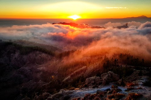 Sun setting over the clouds. by BarryKelly, 