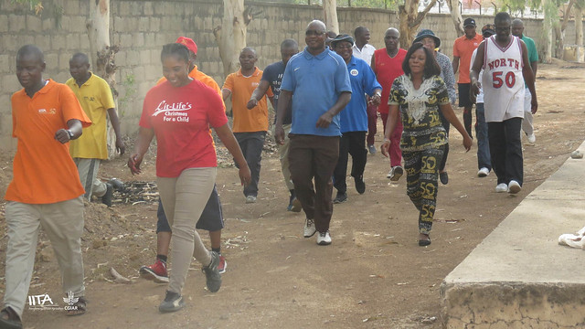 IITA Kano staff walk with West Africa hub administrator