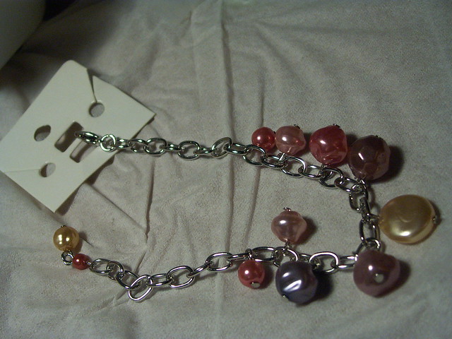 Edited bracelet with pearl theme