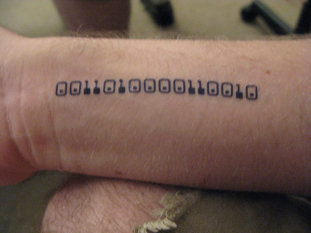 Memory of passed friend done in binary code by Grim at Sundsvall Tattoo  Studio Sweden  rtattoo