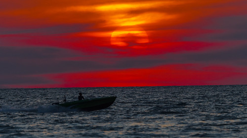 malaysia travel scenery scene sea sunset 300mmf4epfedvr 300mm water outdoor sun boat d500 nikon nikkor nature ngc moody red clouds cloud redsky seascape dramatic