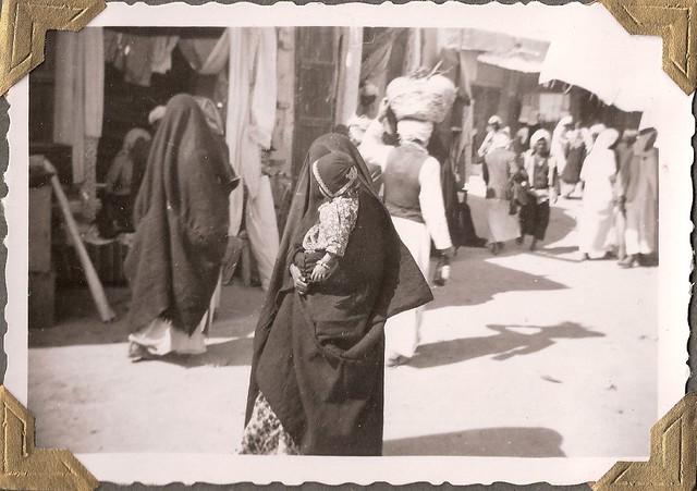 Kuwaitis Woman with baby (الام والرضيع); about 1950.