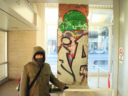 Alex in German army coat with Berlin Wall fragment | Flickr
