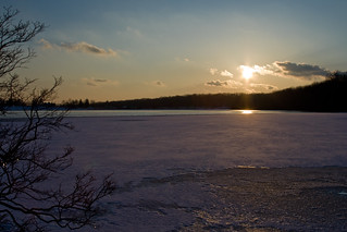 Sunset over frozen pond