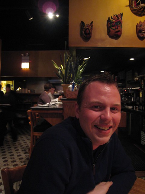 Brian w/ Rick Bayless eating in the background
