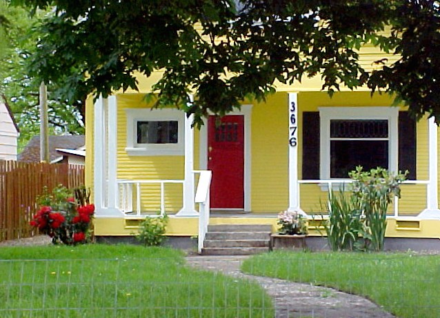 Exterior of yellow painted Tuscan villa with white shutters on half-glazed  double doors Stock Photo - Alamy