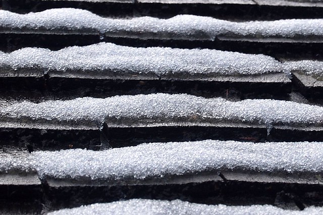Parallel ridgelets of snow decorate shingles