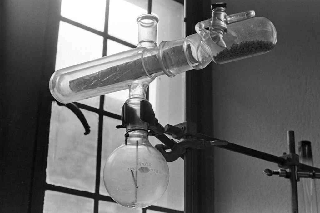 Chemistry Lab - a glass bottle hanging from a hook