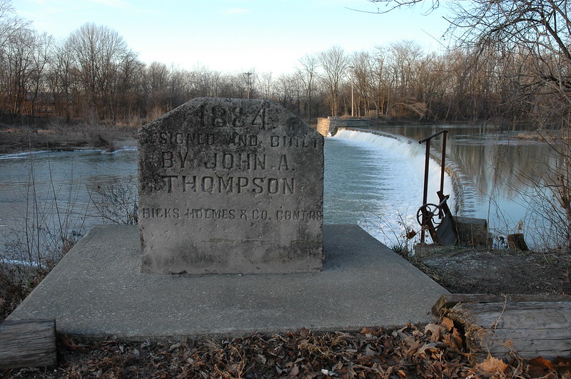 Marker indicating that this dam on the Big Blue River in Edinburgh, Indiana, was designed and built by John A. Thompson.