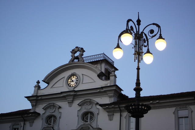 Asti Clock and Streetlamps at Night