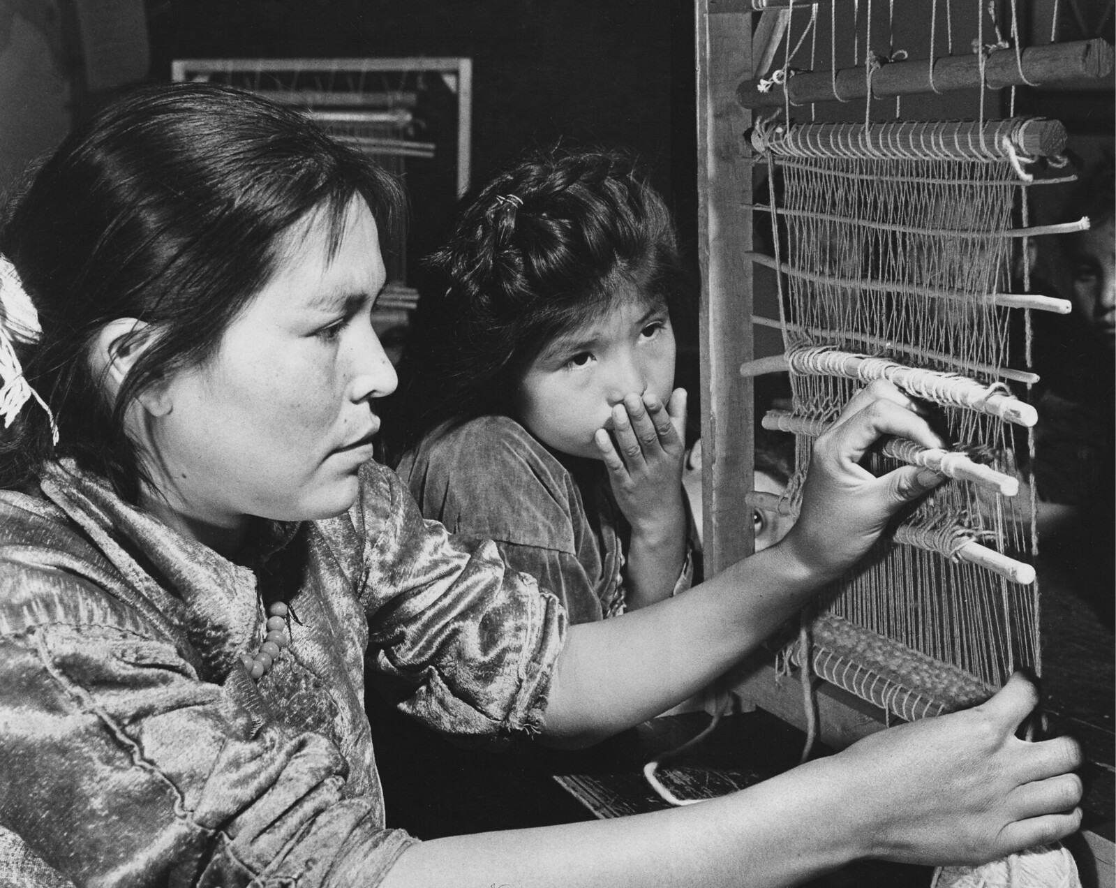 Navajo girls learn first to weave by observation