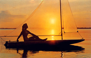 Postcard of Girl on Sailboat at Sunset