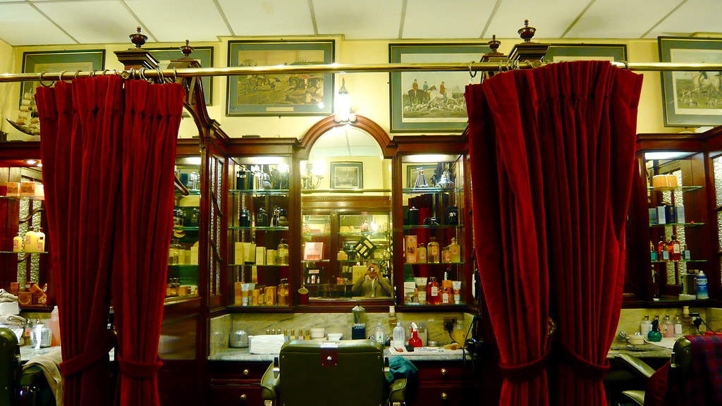 Shop interior with display cabinets and red curtains