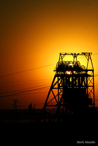 sunset orange sun tower lines wheel silhouette southafrica dusk mining wires geotag johannesburg sjy jinxstudio