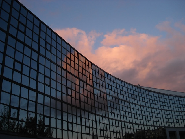 Clouds reflect in building