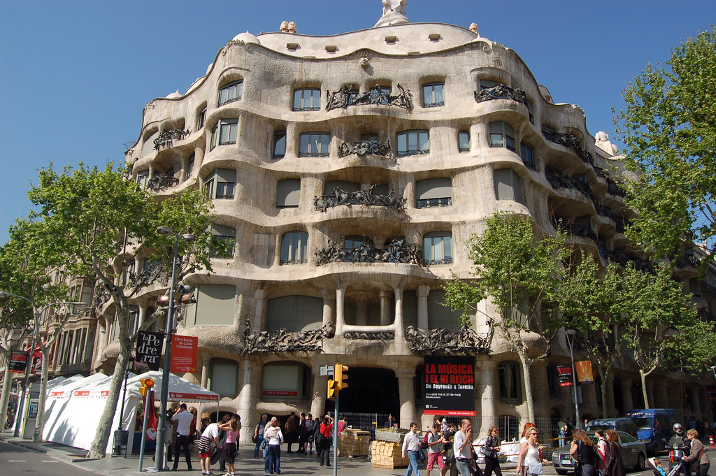 Casa Milà in Barcelona, Spain: Exterior photo of the structure, with wavy levels and balconies. 