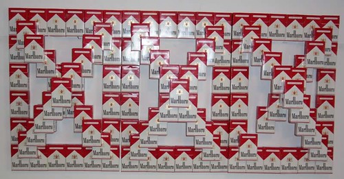 Cig Pyramids III (front view), dimensions variable, Marlboro boxes and glue | by John Norwood