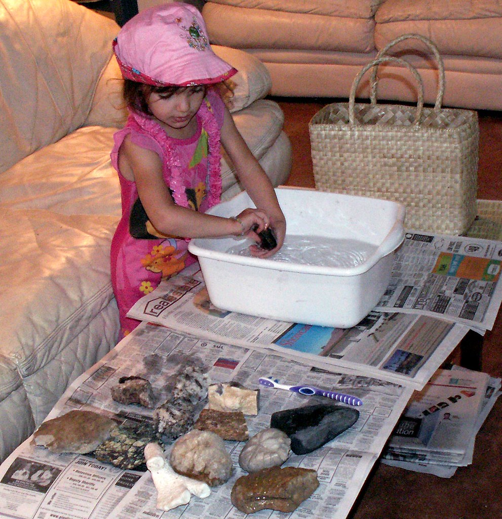 Ana Helps Grandma Wash Rocks, 1 0f 4
