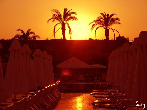 Background of the hotel pool while the sun sets. by *Saariy*