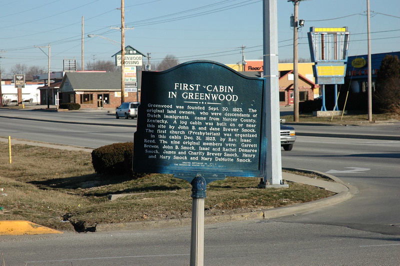 Historical marker for the site of the first cabin in Greenwood, Indiana.  Located on the west side of Madison Avenue in front of Greenwood Park Mall.