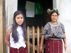Maria Tipaz Ramirez and daughter in front of their little store