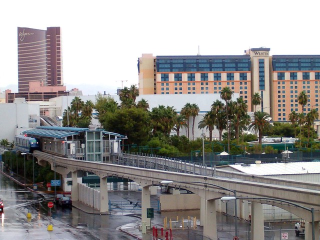 The Las Vegas Monorail stops entering a station with The Wynn and the Westin in the background