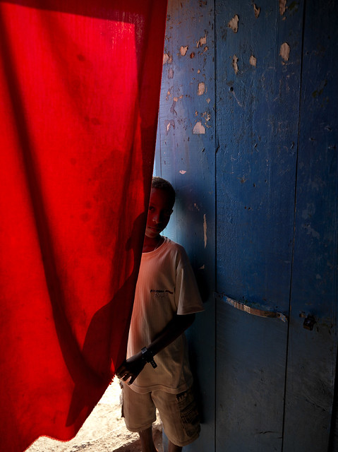 Boy behind a curtain in an improvised cinema, Tadjourah, Djibouti