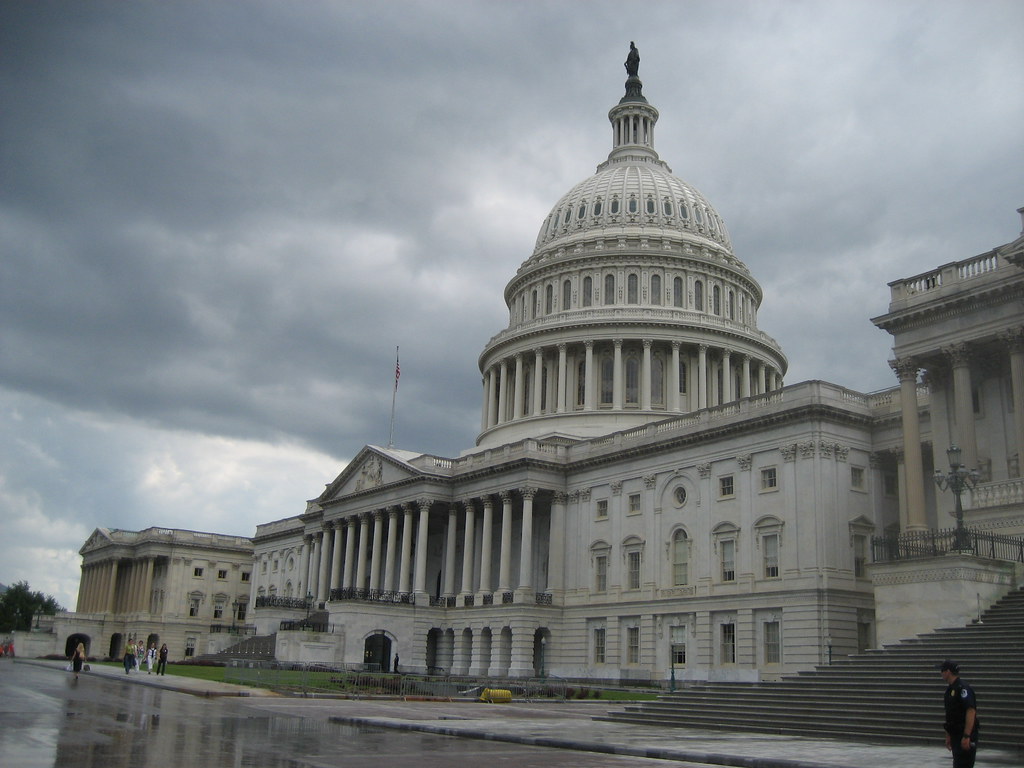 U.S. Capitol Building below a storm