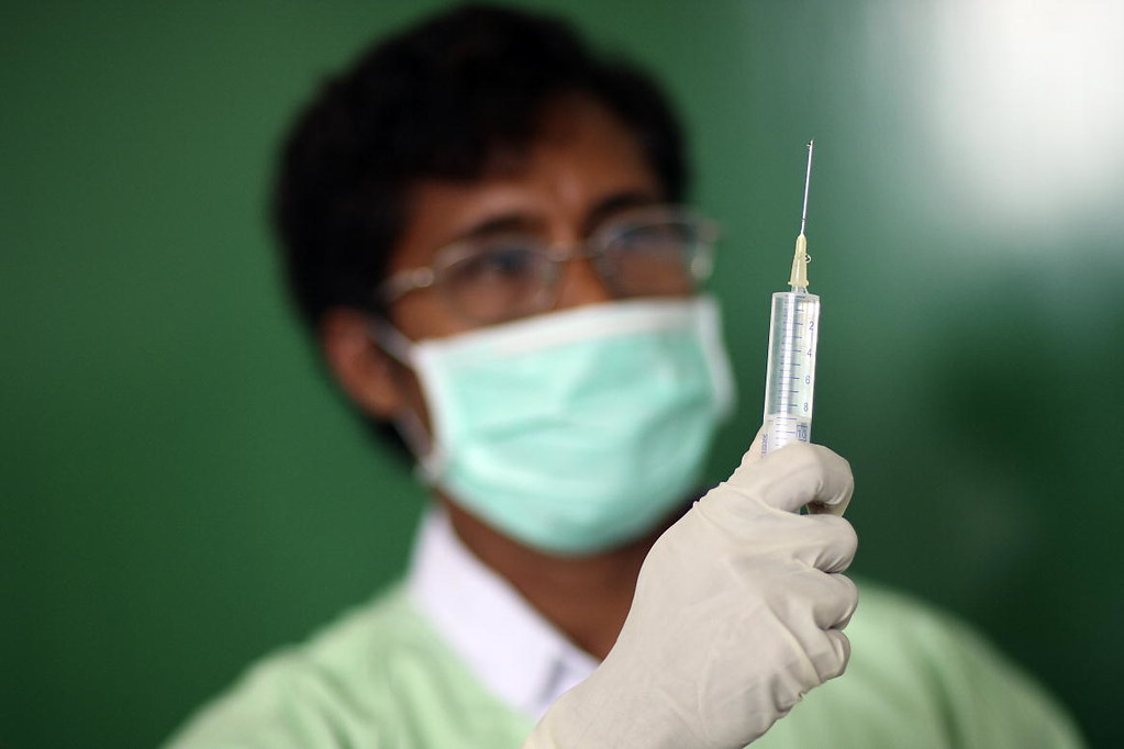 UNMIT Medical Doctor Holds Surgical Syringe