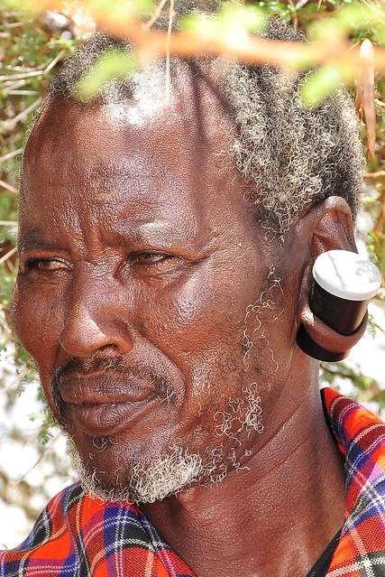Masai man wearing his 35mm Kodak film case, containing snuff, in his earlobe!