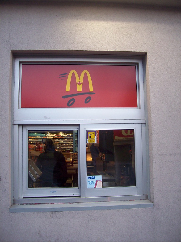 The McDonald's drive-thru window on the side of the Sunoco ...