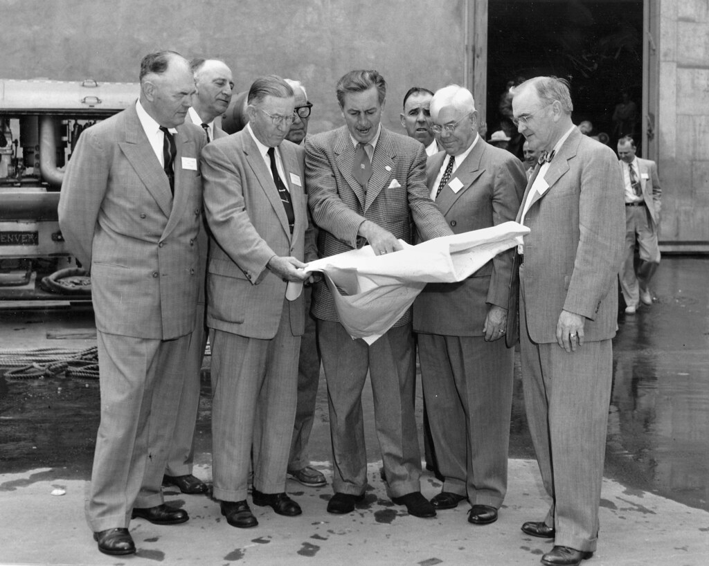 Walt Disney shows Disneyland plans to Orange County officials, Dec. 1954