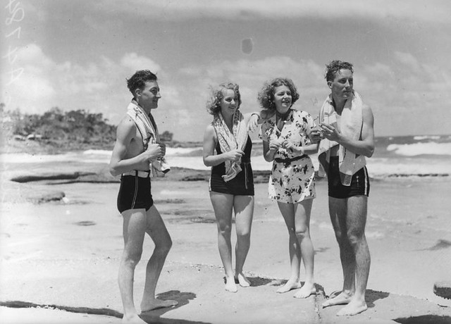 Young people enjoying a day at the beach, ca. 1938