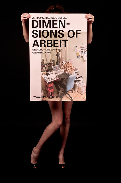 Dimensions of Arbeit - Naked Girl holding the Poster