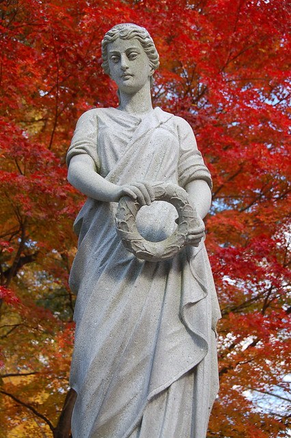 Mt Auburn Cemetery: Statue in front of red autumn leaves