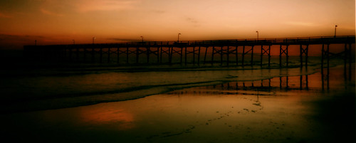 ocean sunset red sea sky reflection film beach analog 35mm pier nc sand surf waves dusk northcarolina scan atlantic processed orton fishingpier atlanticbeach crystalcoast dphdr shotwithacrappydisposableadvantixpanoramiccamera