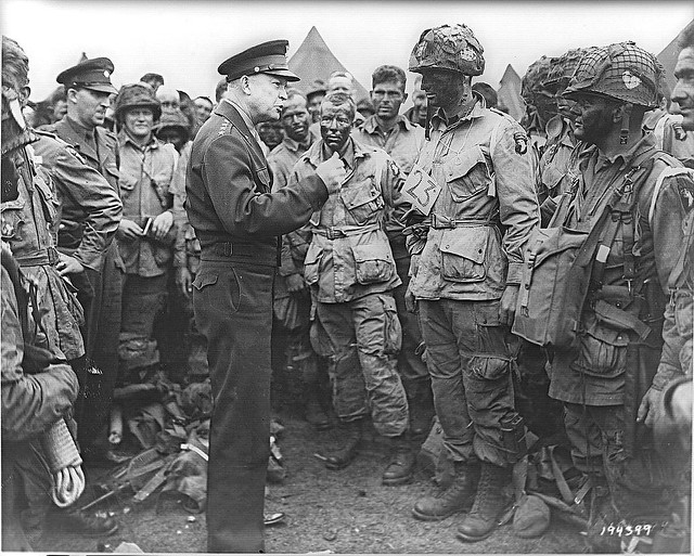 General Dwight D. Eisenhower speaks with 1st Lt. Wallace C. Strobel, 
