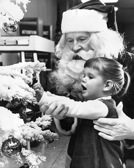 Santa Claus with little girl in 1963 Commonwealth Savings and Loan Association, 5077 Lankershim Blvd., North Hollywood