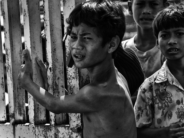 Choeung Ek, Cambodia - Children pleading for help at the gate to the Killing Field
