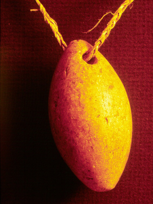 An ancient Chamorro artifact of a slingstone pendant or sinker.

Guam Museum/Judy Flores