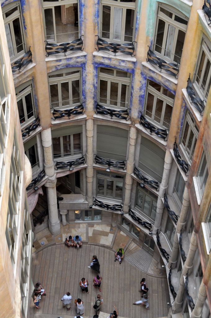 Casa Milà in Barcelona, Spain: A center light well with various windows along the interior of the shaft. 