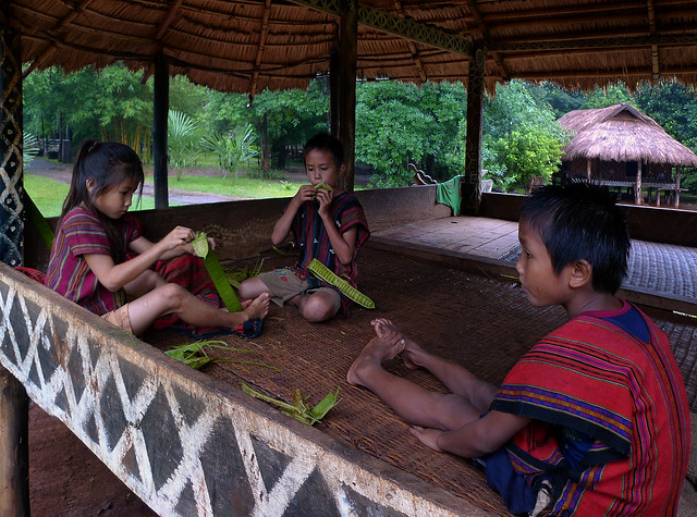 Kids eating Petai - a bitter jungle snack