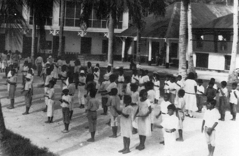 Schoolchildren lined up for a fingernail and cleanliness inspection. Photo from Don Farrell courtesy Anne Hattori.