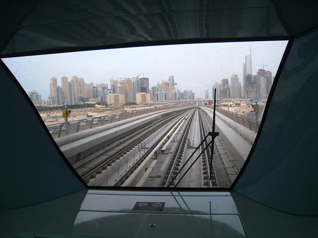 Dubai cityscape from window of metro car, Nakheel Harbour station