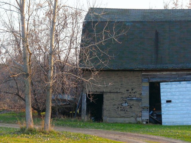 Barn with boat and car