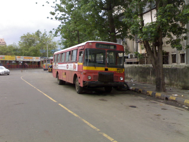 An old ACGL TMT bus waits at Thane Station East